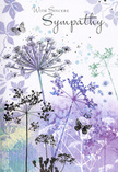 This sympathy card, often chosen to accompany funeral flowers in Charlton, reads like a quiet, visual poem. Inside, airy silhouettes of wild, umbelliferous blooms reach upwards on the page, their fine stems and clustered flower heads painted in layered tones of lavender, dusky indigo, and soft, silvery blue. The flowers appear weightless, as if they might sway with the faintest breath of air, echoing the stillness you might feel walking past the trees near Charlton station or pausing by the greens around Charlton Park. Each delicate umbel is rendered with intricate, lace-like detail yet softened at the edges by gentle washes of watercolour, giving the impression of a meadow seen through light morning mist. Faint suggestions of foliage drift behind the blooms, their shapes ghost-like and distant, adding depth without crowding the composition. Scattered among the stems, butterflies hover, their wings pale and almost transparent, symbolising transformation and the continuing presence of loved ones in memory. The palette remains cool but comforting, with mixed purples and cool greens blending like a calm sky after rain over the Thames. Above the tranquil scene, the words 'With Sincere Sympathy' or a similar message are inscribed in graceful script, providing a tender focus without overshadowing the artwork. As local florists, we often pair this card with soft, natural condolence arrangements delivered across Charlton and nearby areas, knowing its gentle design offers a respectful, heartfelt way to express care and remembrance during times of loss.